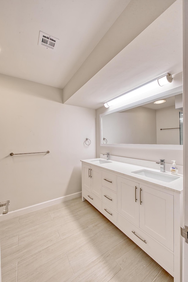 bathroom featuring vanity and hardwood / wood-style floors