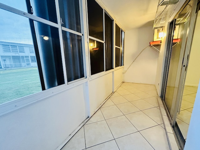 corridor with tile patterned flooring