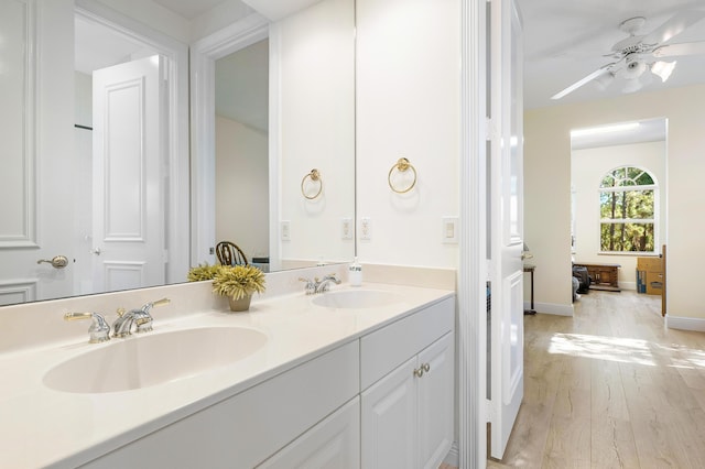 bathroom featuring ceiling fan, vanity, and hardwood / wood-style floors