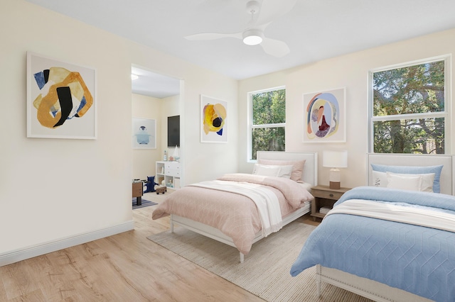 bedroom featuring ceiling fan and light hardwood / wood-style floors