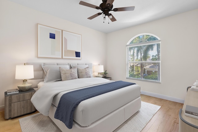 bedroom featuring light hardwood / wood-style floors and ceiling fan