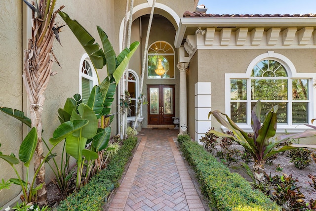 entrance to property featuring french doors