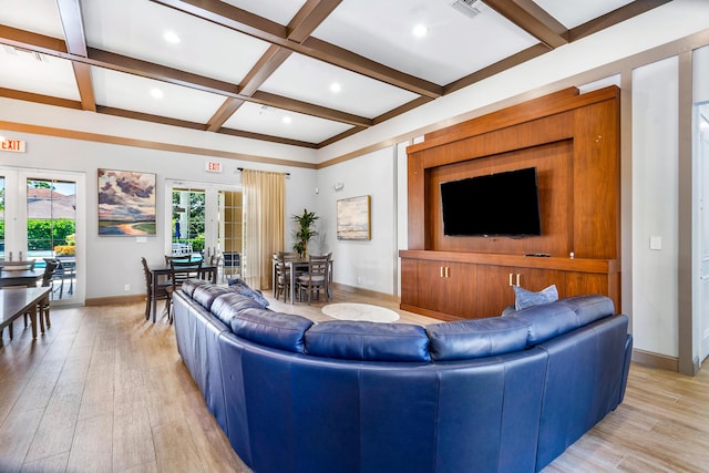 living room featuring coffered ceiling, french doors, beamed ceiling, and light wood-type flooring