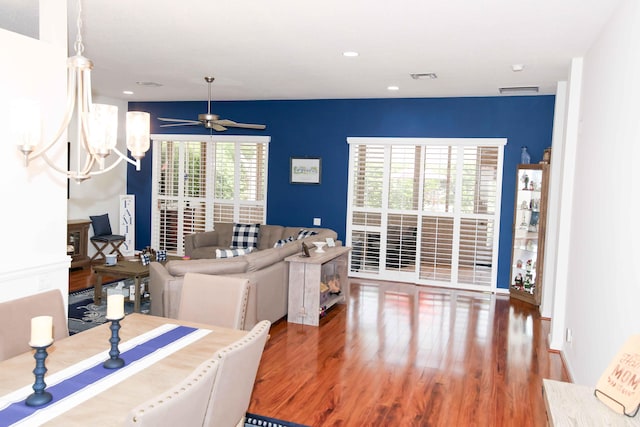 living room with hardwood / wood-style floors and ceiling fan