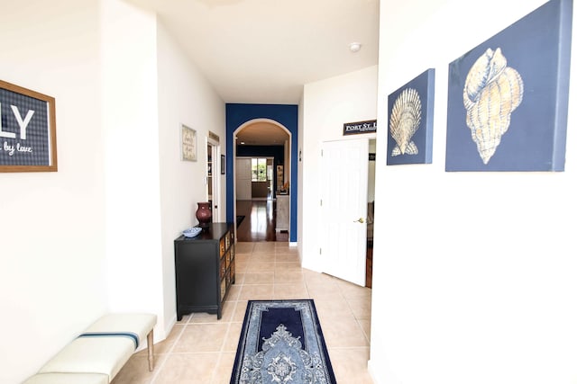 hallway featuring light tile patterned floors