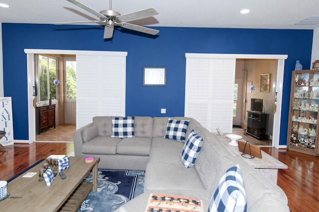 living room with ceiling fan and hardwood / wood-style floors