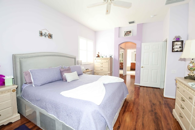 bedroom with dark hardwood / wood-style floors and ceiling fan