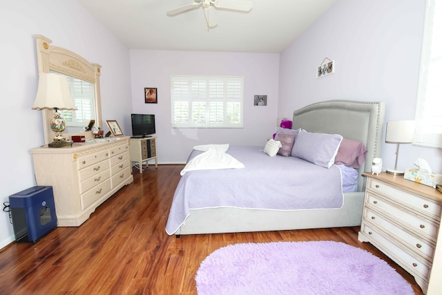 bedroom featuring ceiling fan and dark hardwood / wood-style flooring