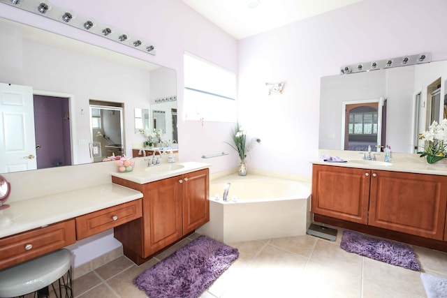 bathroom featuring vanity, a bathing tub, and tile patterned flooring