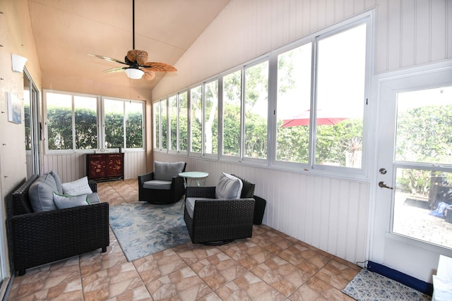 sunroom / solarium featuring ceiling fan and lofted ceiling