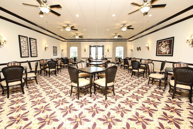 carpeted dining space featuring crown molding