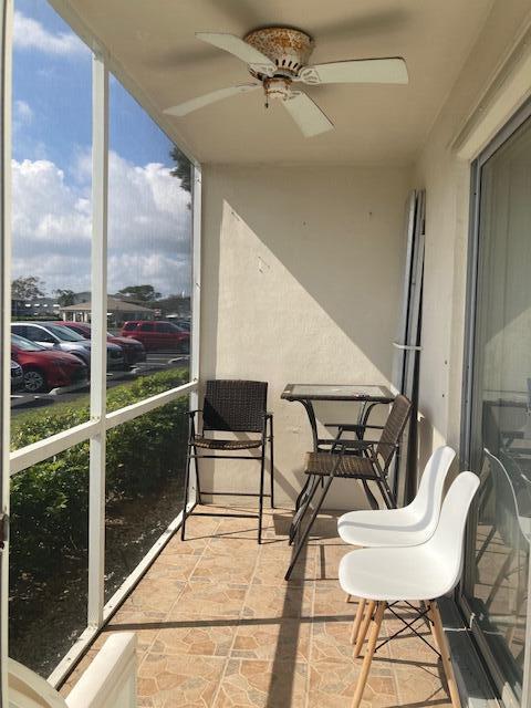 balcony featuring ceiling fan