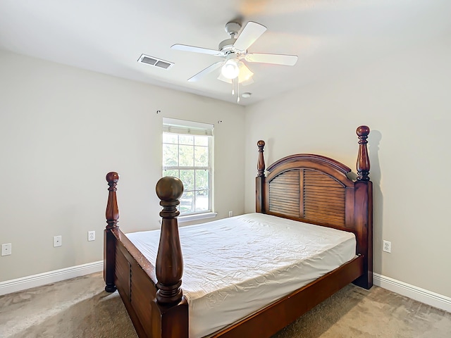 bedroom featuring ceiling fan and light carpet