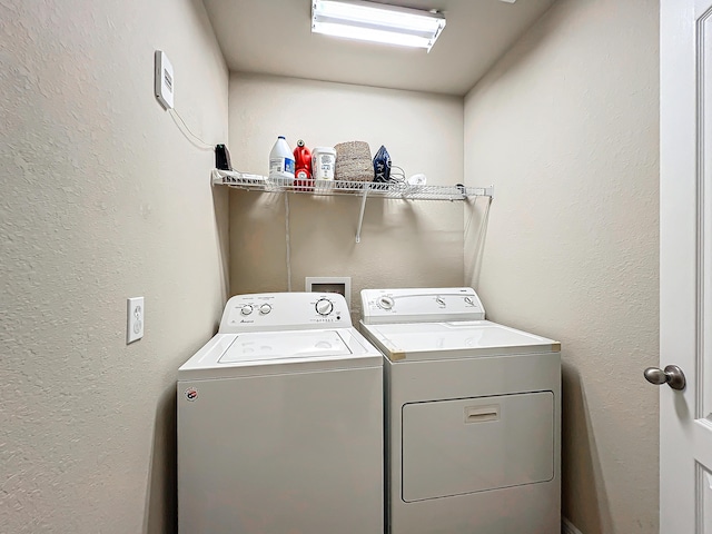 washroom with washer and clothes dryer