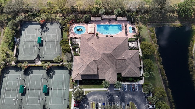 birds eye view of property with a water view