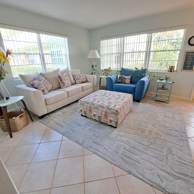 tiled living room with plenty of natural light