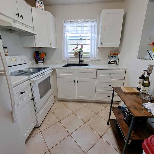 kitchen with white cabinetry, sink, light tile patterned floors, light stone counters, and white appliances