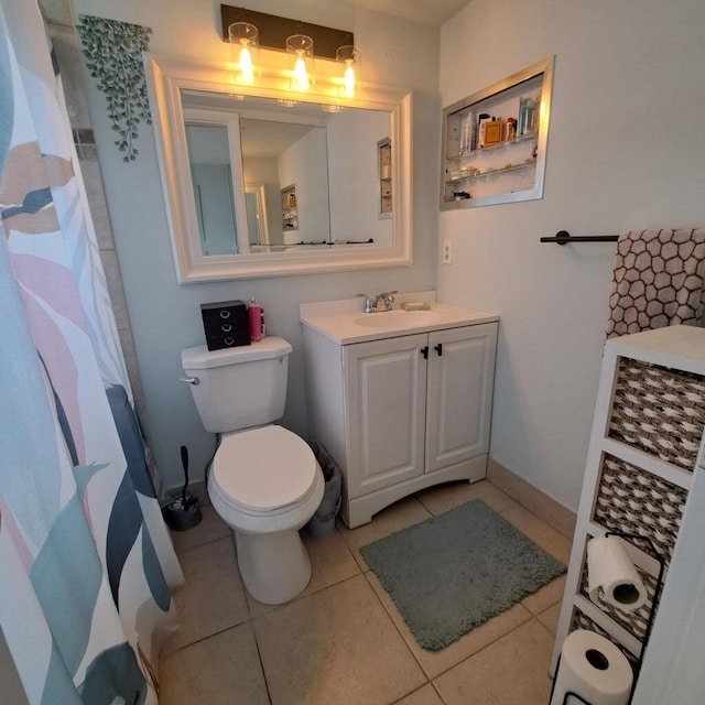 bathroom with vanity, tile patterned floors, and toilet