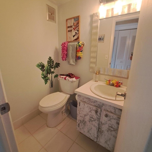 bathroom with tile patterned floors, vanity, and toilet