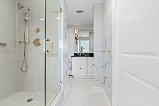 full bath featuring visible vents, a shower stall, and vanity