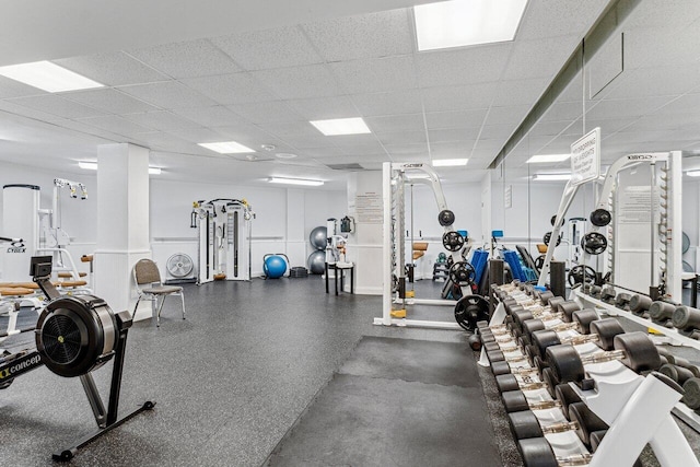 gym featuring a drop ceiling