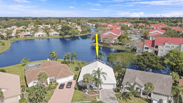 birds eye view of property with a water view