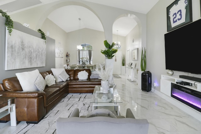 living room with vaulted ceiling and a chandelier