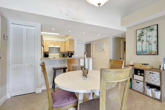 tiled dining area with sink