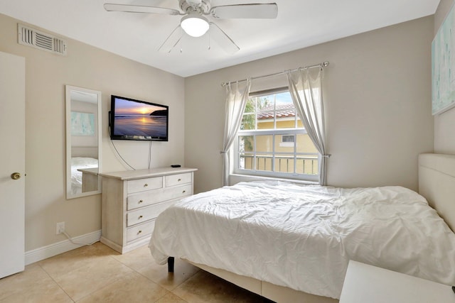 bedroom featuring light tile patterned floors and ceiling fan