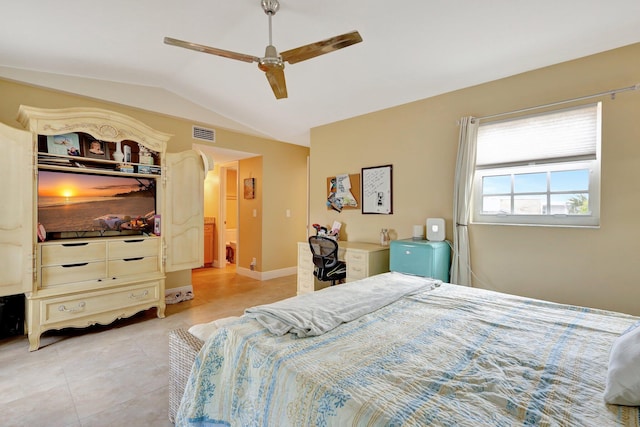 bedroom with ceiling fan, vaulted ceiling, and light tile patterned floors