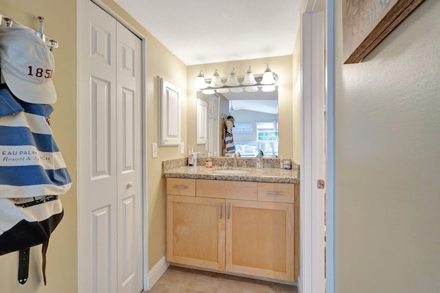 bathroom with vanity and tile patterned floors