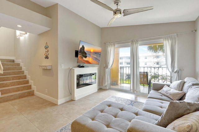 tiled living room with ceiling fan