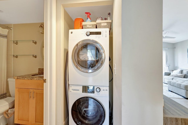 laundry area with stacked washer / drying machine