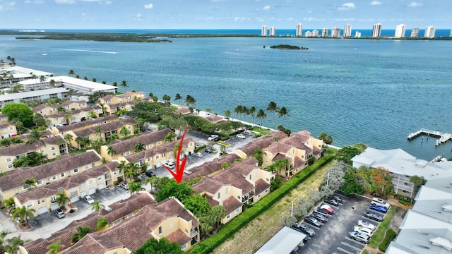 birds eye view of property featuring a water view