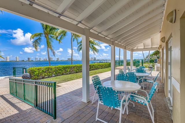 view of patio with a water view