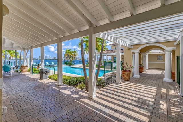 view of patio / terrace with a community pool and a pergola