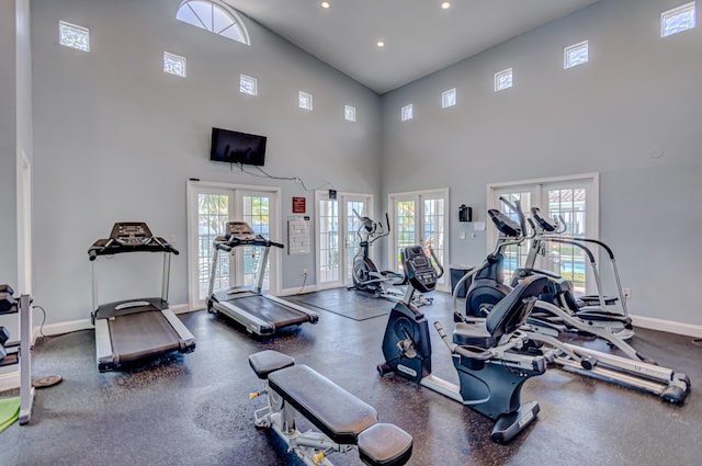 gym featuring french doors and a healthy amount of sunlight