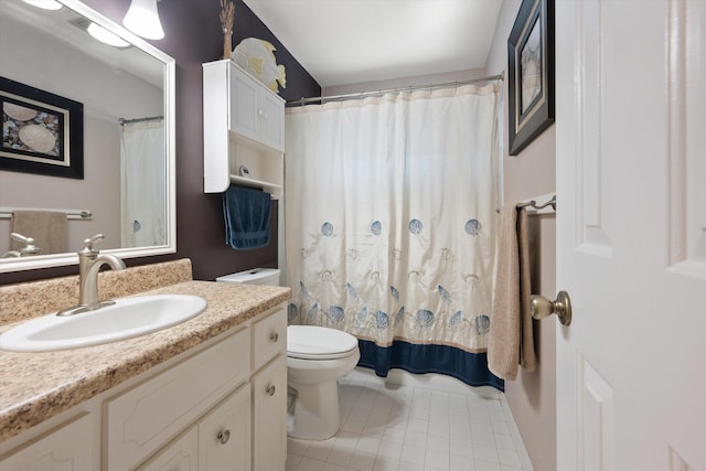 bathroom with vanity, a shower with shower curtain, tile patterned floors, and toilet