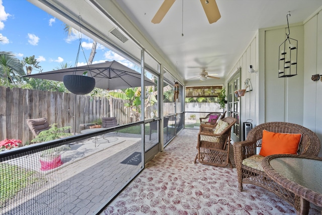 sunroom / solarium with ceiling fan