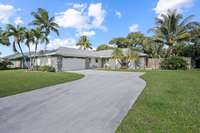 ranch-style home with a garage and a front yard