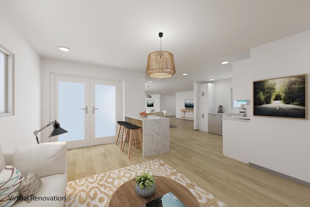 living room with french doors and light hardwood / wood-style flooring