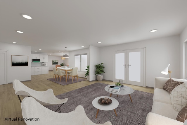 living room with light hardwood / wood-style floors and french doors