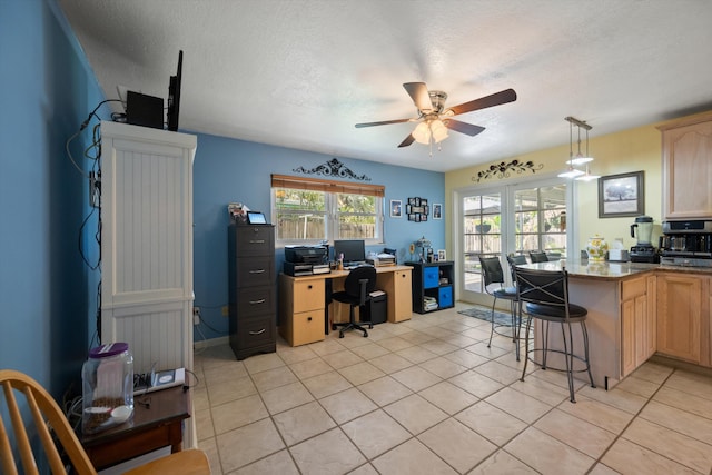 tiled office with ceiling fan and a textured ceiling