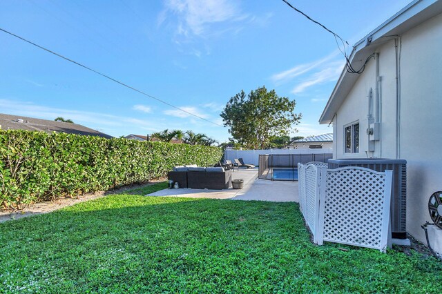 view of yard with a pool and a patio area