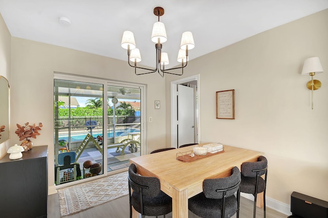 dining space featuring a chandelier and hardwood / wood-style floors