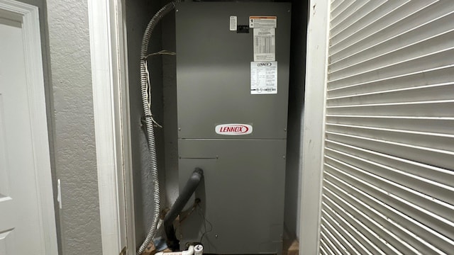 utility room with heating unit