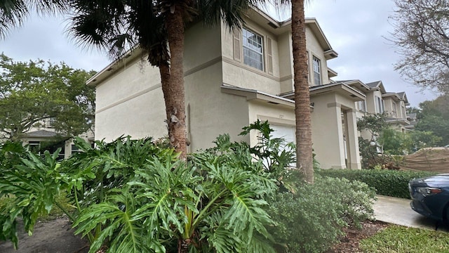 view of side of home with a garage