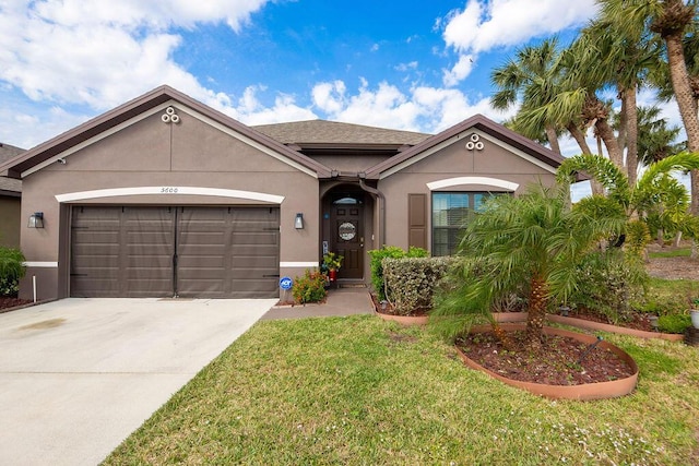 view of front of home with a garage and a front yard