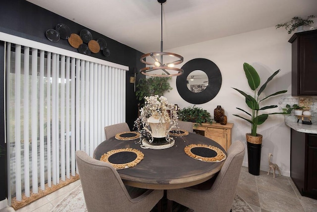 dining area with an inviting chandelier