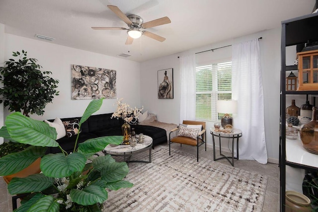 living area with ceiling fan